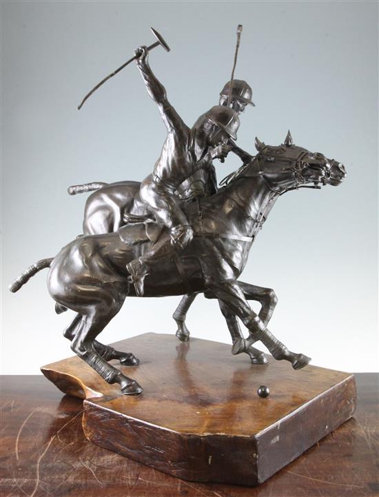 A 20th century bronze equestrian figure group, modelled as two polo players, 23.5in.